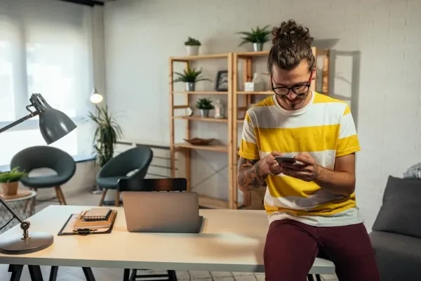 Productive, energetic man at work in his home office